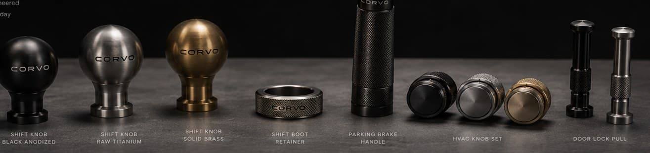 Concept lineup of possible future CORVO pieces alongside the three shift knob materials: shift boot retainer, parking brake handle, HVAC knobs, and door lock pulls. Marks shown are not final.